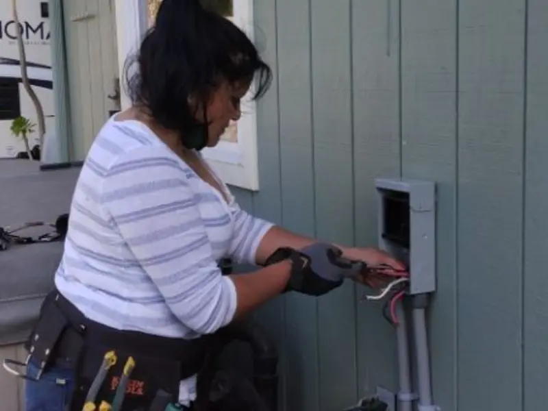Licensed electrician wiring an exterior subpanel in Chelan